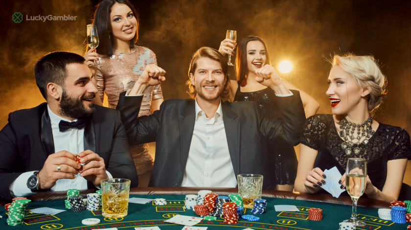 Photo of a busy casino at night with many players and bright lighting, showcasing a lively and energetic atmosphere